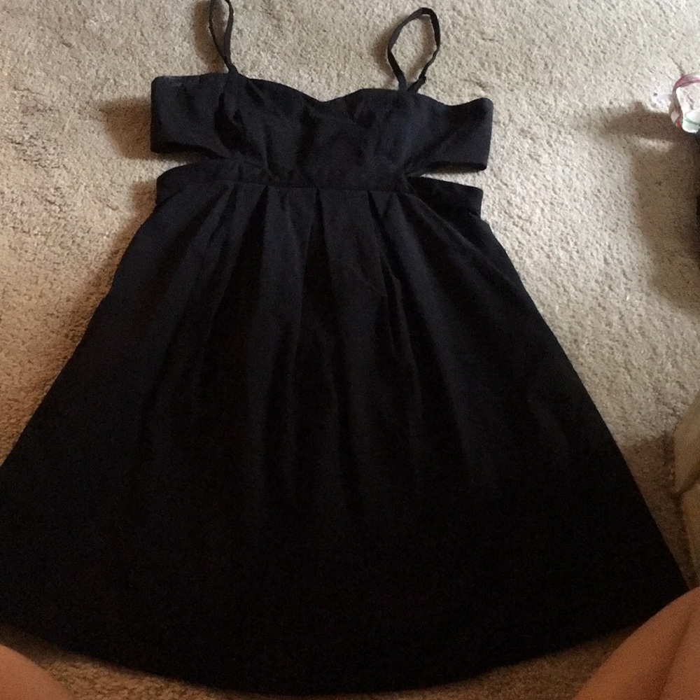 Small black dress with slit sides. A line